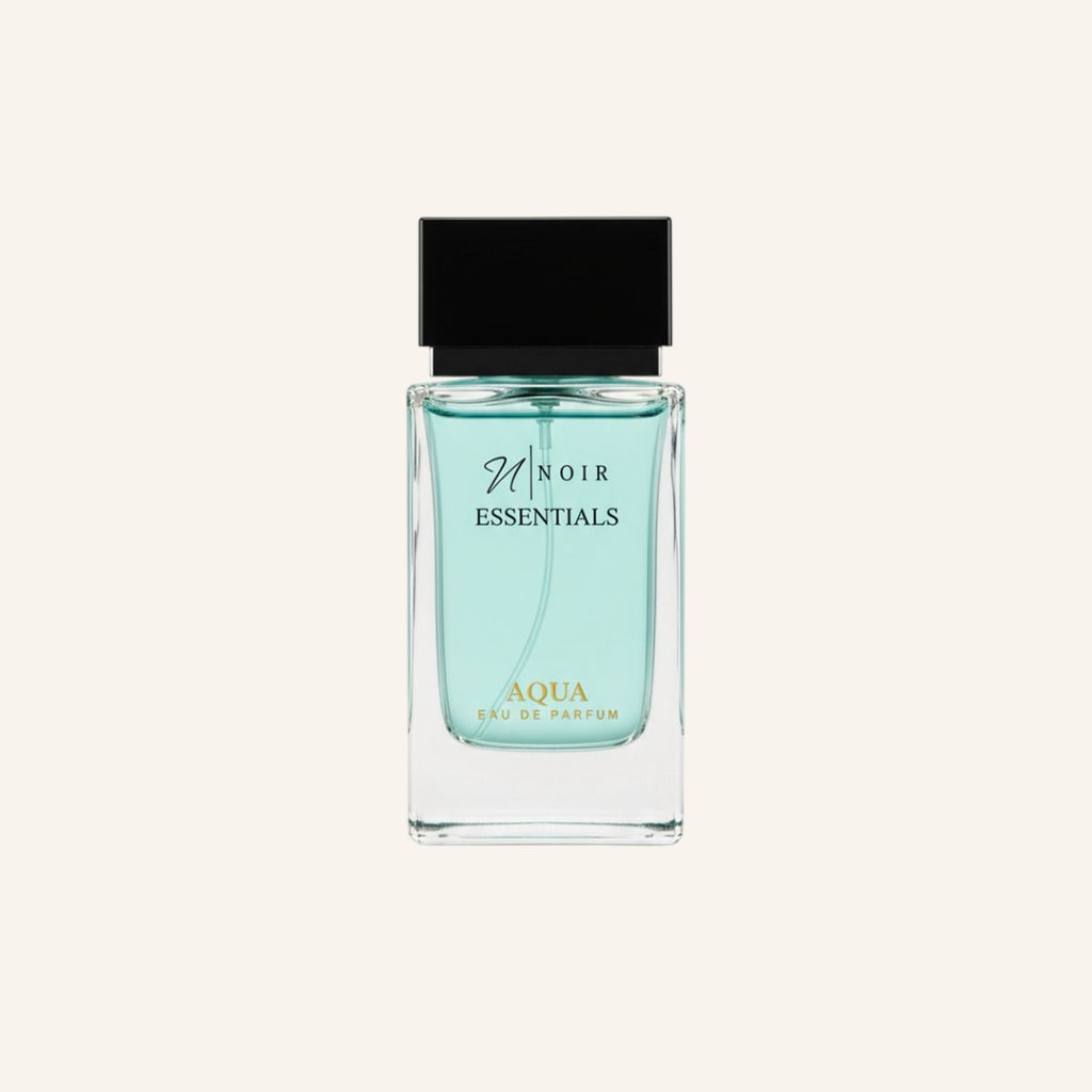 Perfume bottle labeled 'noir Essentials Aqua' on a white background