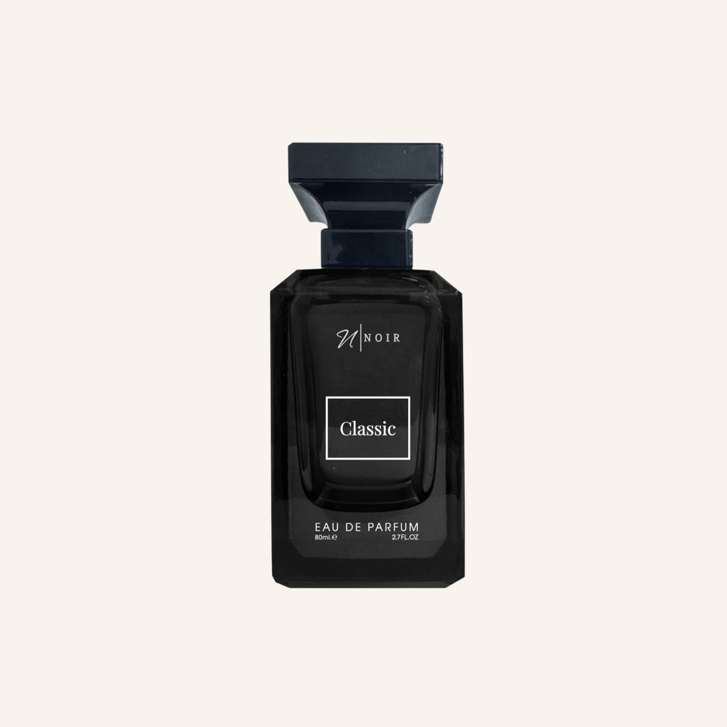 Black perfume bottle labeled 'Noir Classic' on a light gray background