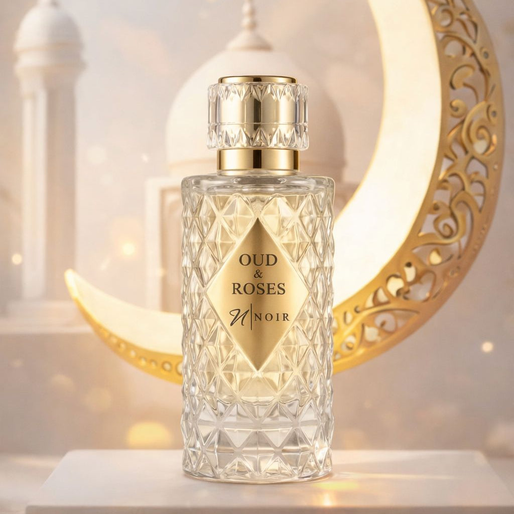 Perfume bottle labeled 'Oud & Roses' with a decorative crescent moon in the background