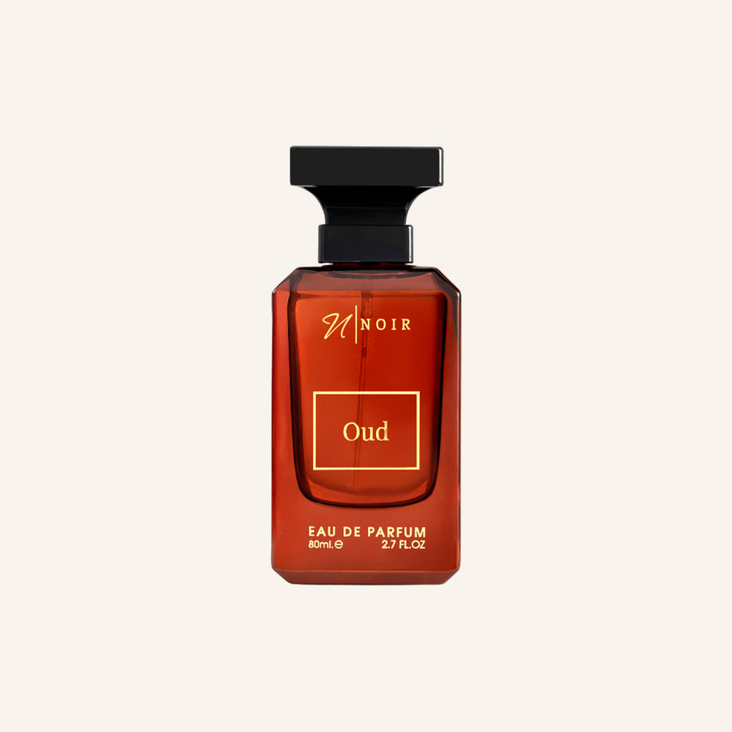 Brown perfume bottle labeled 'Oud' on a white background